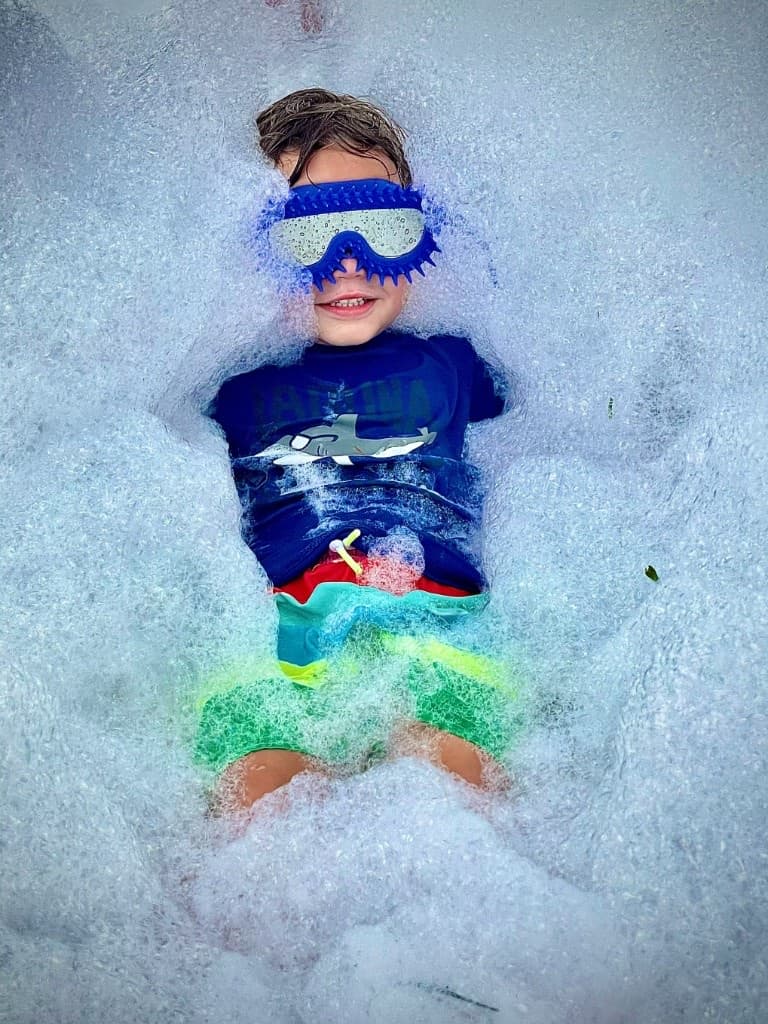 A kid in foam with goggles